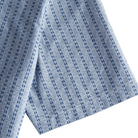 OROMEN Sashiko Chambray shirt sleeve detail, navy running stitch pattern on washed chambray blue cotton