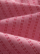 OROMEN Sashiko Cotton Shirt fabric detail highlighting tonal sashiko stitching on coral cotton