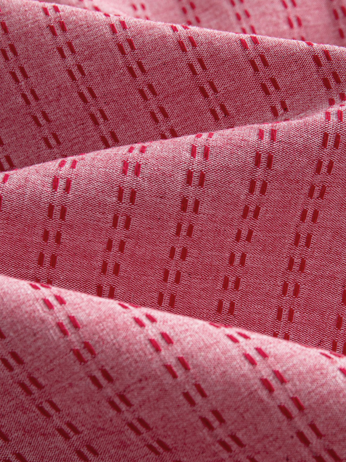 OROMEN Sashiko Cotton Shirt fabric detail highlighting tonal sashiko stitching on coral cotton