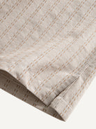 OROMEN Sashiko Stripe Cotton Shirt hem detail showing subtle side vent and clean tailored finish