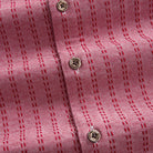OROMEN Sashiko Stripe shirt branded coconut button close-up, crimson dash stripe on rose pink cotton