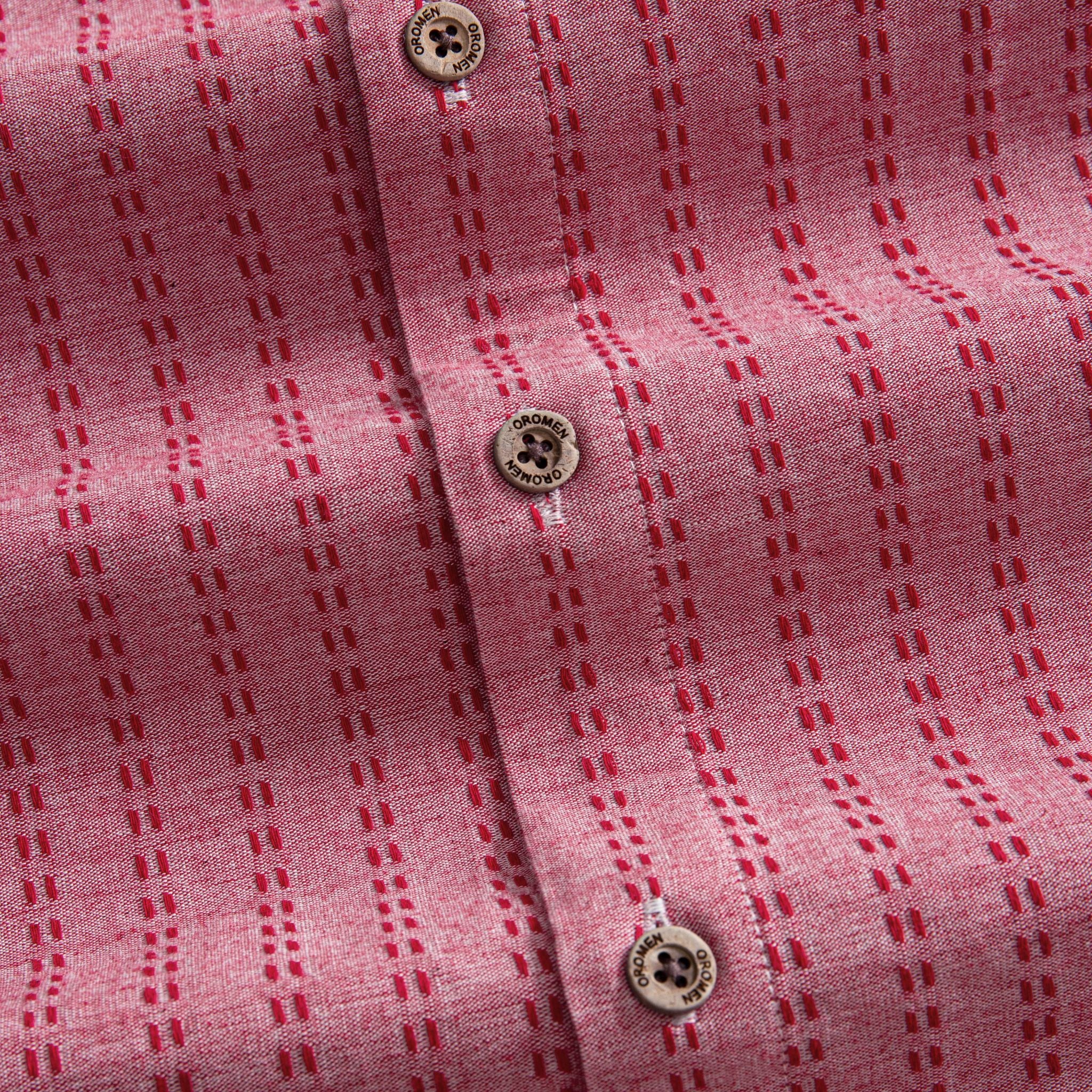 OROMEN Sashiko Stripe shirt branded coconut button close-up, crimson dash stripe on rose pink cotton