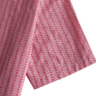 OROMEN Sashiko Stripe shirt sleeve detail, crimson running stitch stripe on rose pink cotton