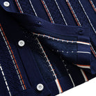 OROMEN Striped Jacquard Openwork Knit Polo navy blue front hem center detail