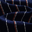 OROMEN Striped Jacquard Openwork Knit Polo navy blue openwork knit fabric texture close-up