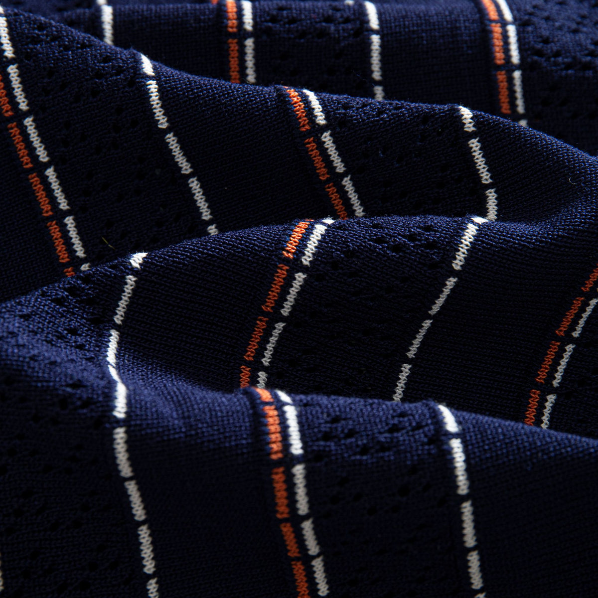 OROMEN Striped Jacquard Openwork Knit Polo navy blue openwork knit fabric texture close-up