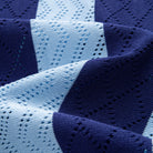 OROMEN Striped Knit Shirt – Close-up Silver-Tone Button Detail