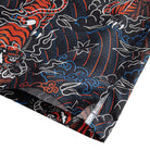 OROMEN Tiger Wave Hawaiian Shirt – side slit hem detail with white lining red tiger head and blue wave print double-needle stitching