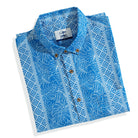 OROMEN Totem And Leaf Hawaiian Shirt flat lay — hand-painted blue totem and leaf prin