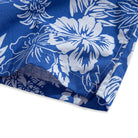 OROMEN Tropical Paradise Hawaiian Shirt – side slit hem detail with white hibiscus floral print on navy blue, showing side vent opening and double-needle stitching