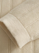 OROMEN Vertical Stripe Contrast Knit Polo sleeve cuff detail showing structured ribbed knit finish