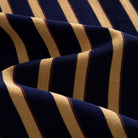 OROMEN Vertical Stripe Knit Polo navy blue navy gold stripe knit fabric texture close-up