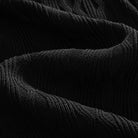 OROMEN Wave Jacquard Knit Polo black viscose knit fabric texture close-up