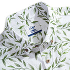 OROMEN brand label and engraved coconut buttons detail on Willow Bough Hawaiian shirt collar