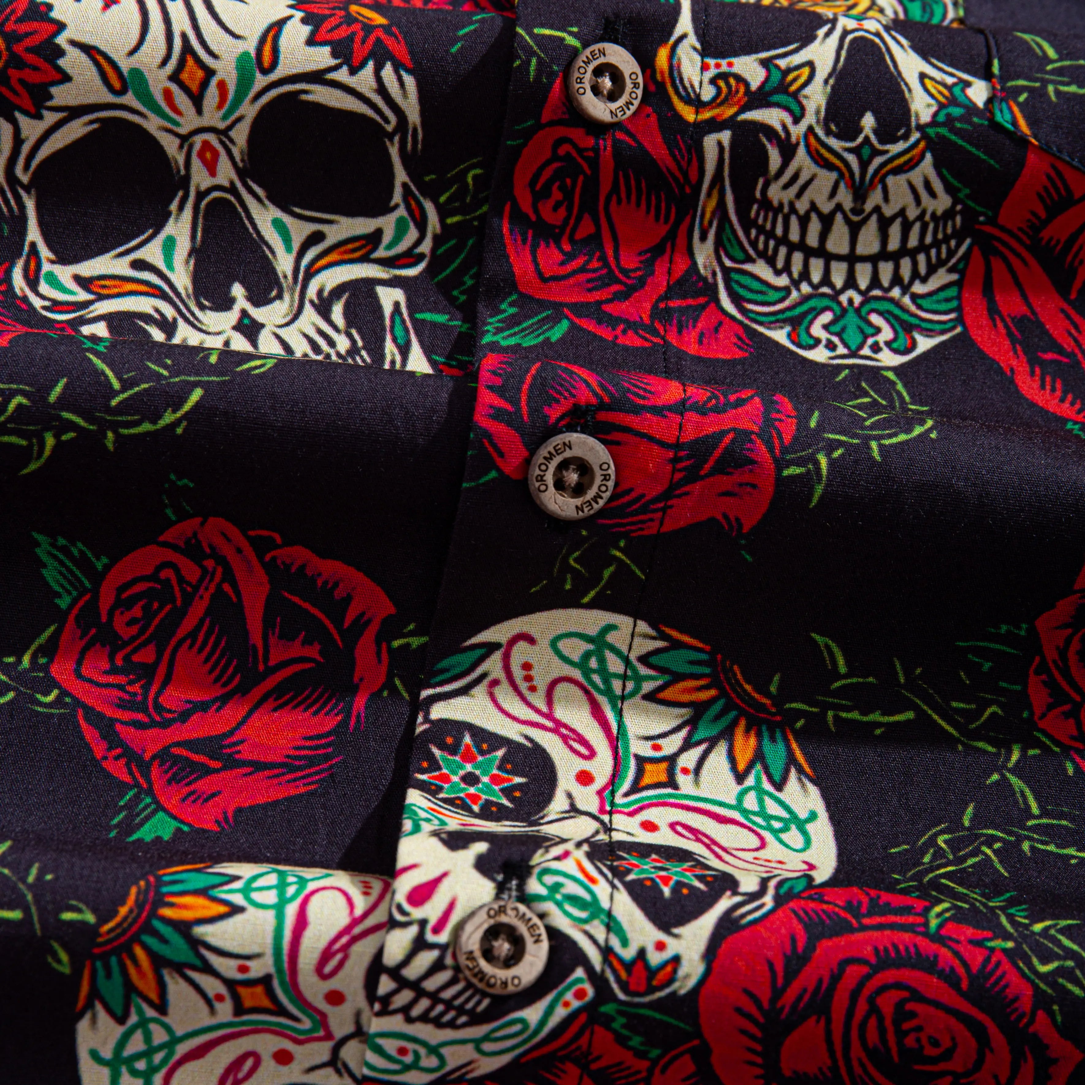 OROMEN engraved coconut buttons and sugar skull rose print detail on Bloom And Death Hawaiian shirt