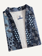 OROMEN indigo floral kimono cardigan folded, showing pattern and texture