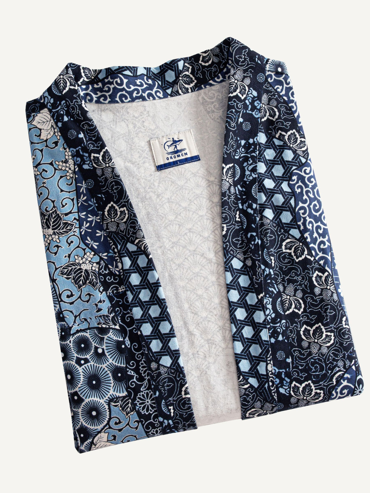 OROMEN indigo floral kimono cardigan folded, showing pattern and texture