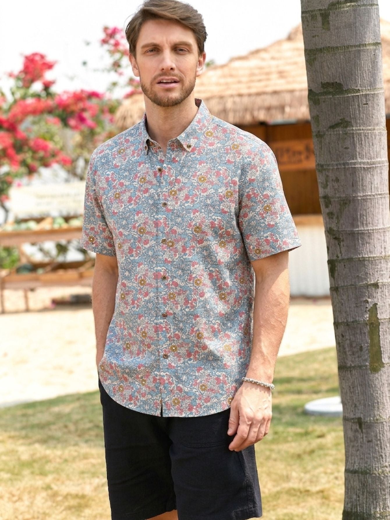 OROMEN Floral  Botanical Style Hawaiian Shirt – Model Shot; All-over print featuring pink peonies and blue foliage.