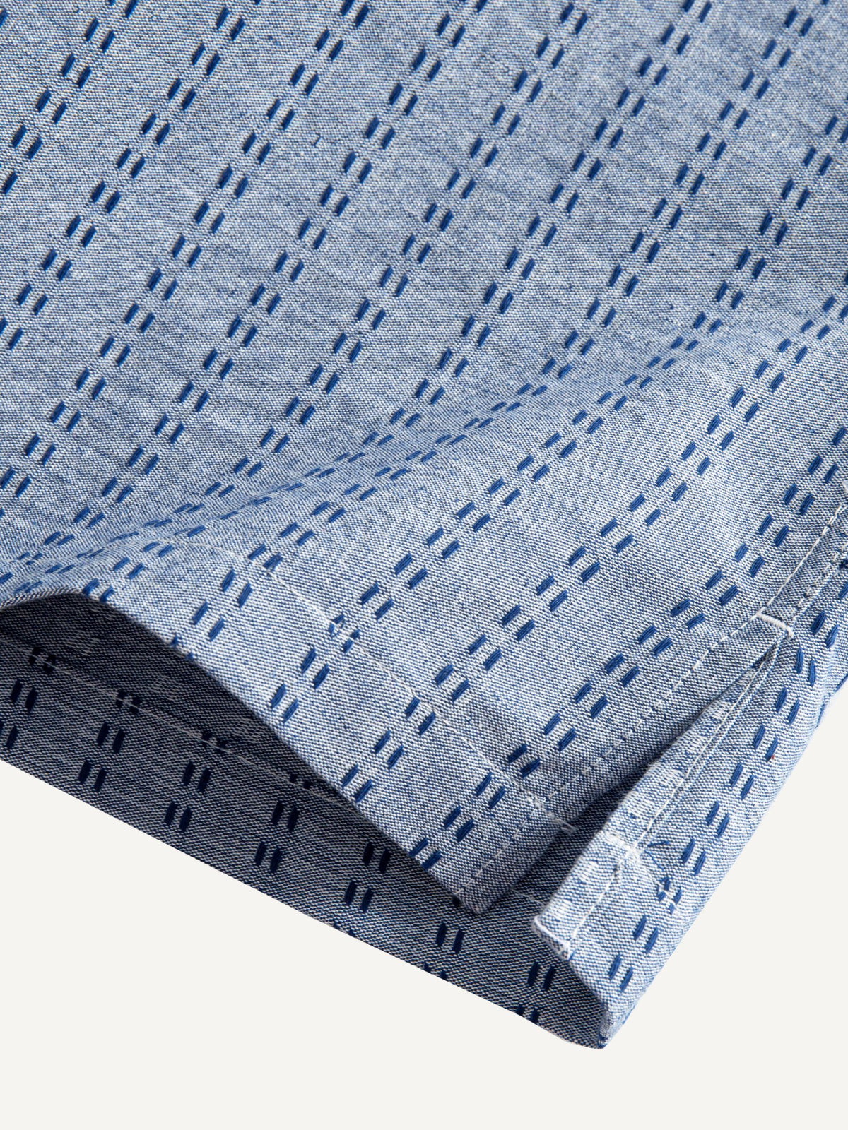 OROMEN Sashiko Chambray Cotton Shirt hem detail showing subtle side vent and tailored finish