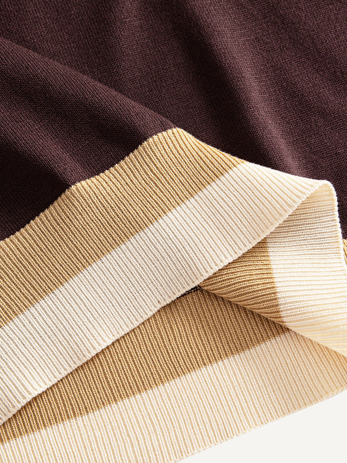 Ribbed bottom hem detail on OROMEN Casa Mocha Knit Polo