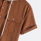 Rolled cuff detail on rust brown polyester short sleeve of OROMEN dual pocket hooded shirt