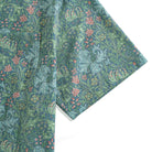Secret Garden green linen shirt flat lay showing full floral pattern design