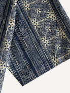 Short sleeve cuff and double-needle stitching detail of OROMEN Indigo Batik Shirt