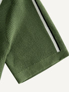 Short sleeve cuff detail on OROMEN Marcel Striped Knit Polo