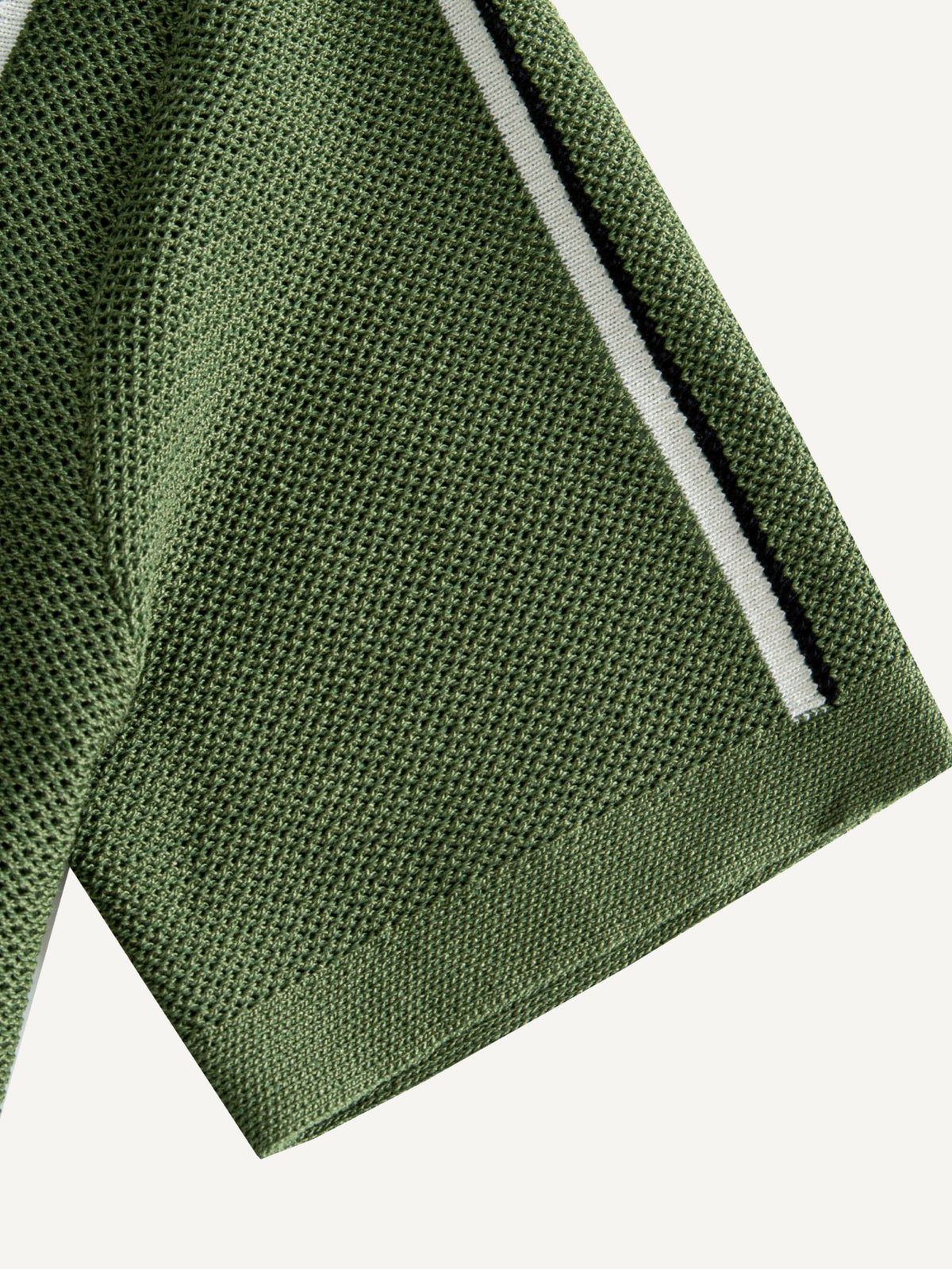 Short sleeve cuff detail on OROMEN Marcel Striped Knit Polo