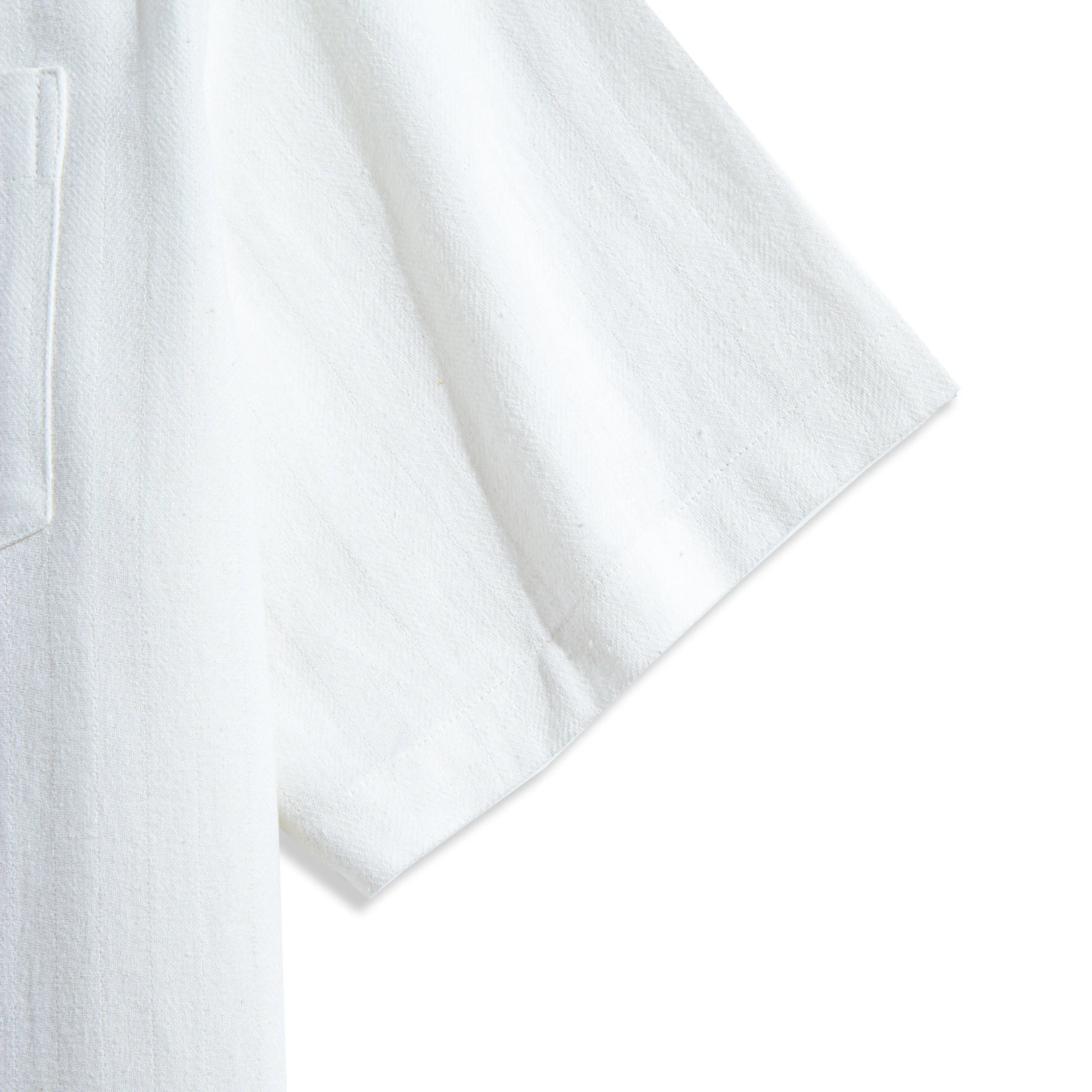 Short sleeve hem of OROMEN Embossed Striped Shirt – white Tencel™ linen with relaxed drape and natural texture
