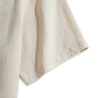 Short sleeve hem of OROMEN Versatile Shirt – beige Tencel™ linen with relaxed drape and natural linen texture