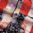 Side detail of Sakura Bokashi shirt featuring vibrant red floral motifs and side vent