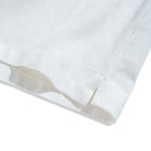 Side vent and double needle stitching detail of OROMEN Embossed Striped Shirt – white Tencel™ linen hem