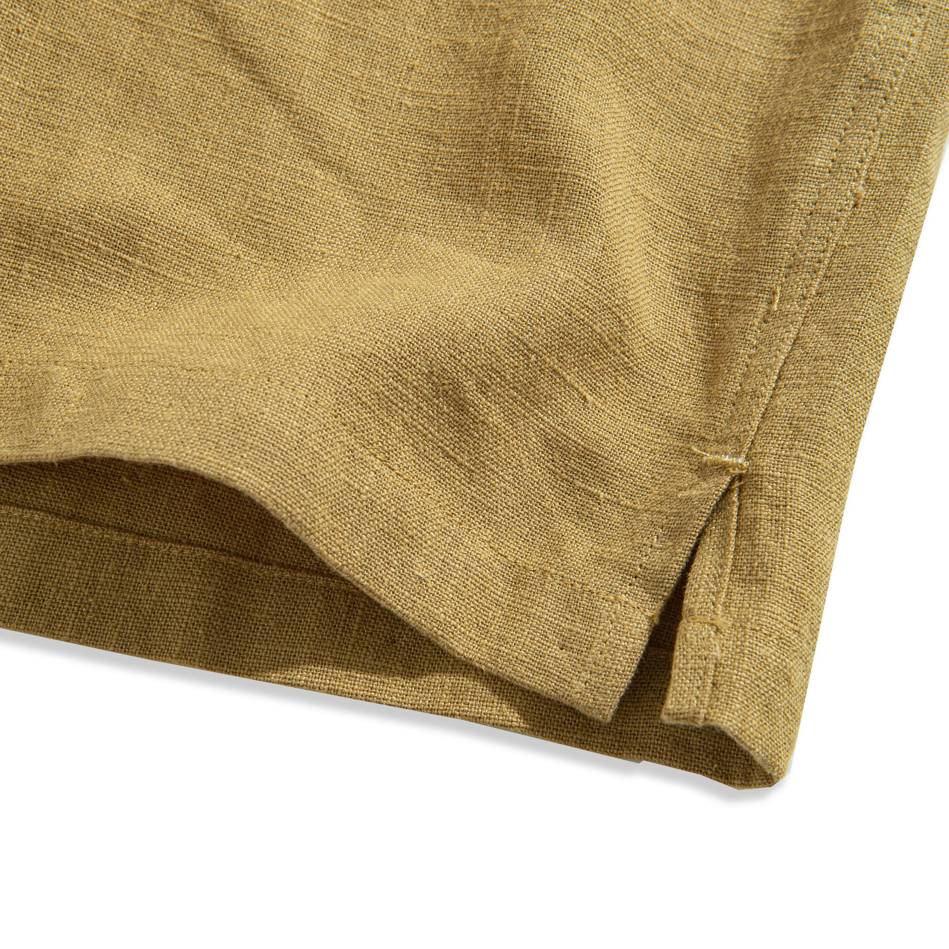 Side vent detail on tailored linen shirt - enhanced comfort and mobility