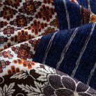 Silk Road Patchwork shirt fabric drape showing three patchwork panels layered - Persian carpet print, indigo ikat stripe and dark brown large floral