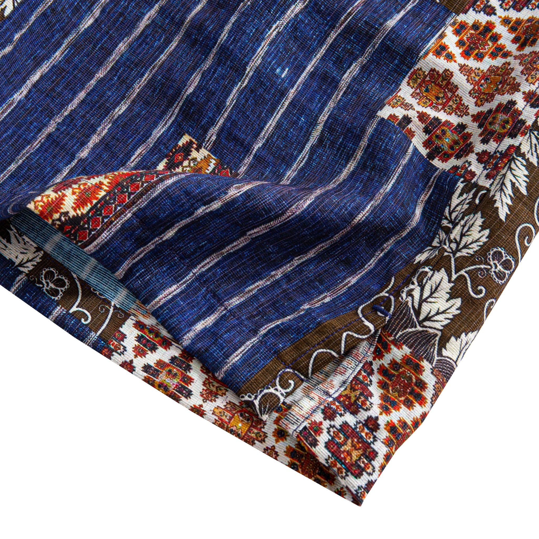 Silk Road Patchwork shirt hem and side vent detail showing indigo stripe body with ethnic geometric hem border and dark floral panel