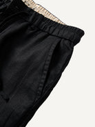 Slant side pocket detail of OROMEN Crosshatch Weave Drawstring Trousers