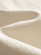 Texture detail of 100% pure cotton breathable slub weave fabric in beige