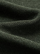 Texture detail of breathable lyocell and linen blend knit fabric in heathered olive green