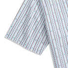 Textured stripe pattern with embroidered accents - premium cotton craftsmanship