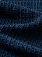 Textured vertical rib knit fabric detail of breathable linen-lyocell blend cardigan