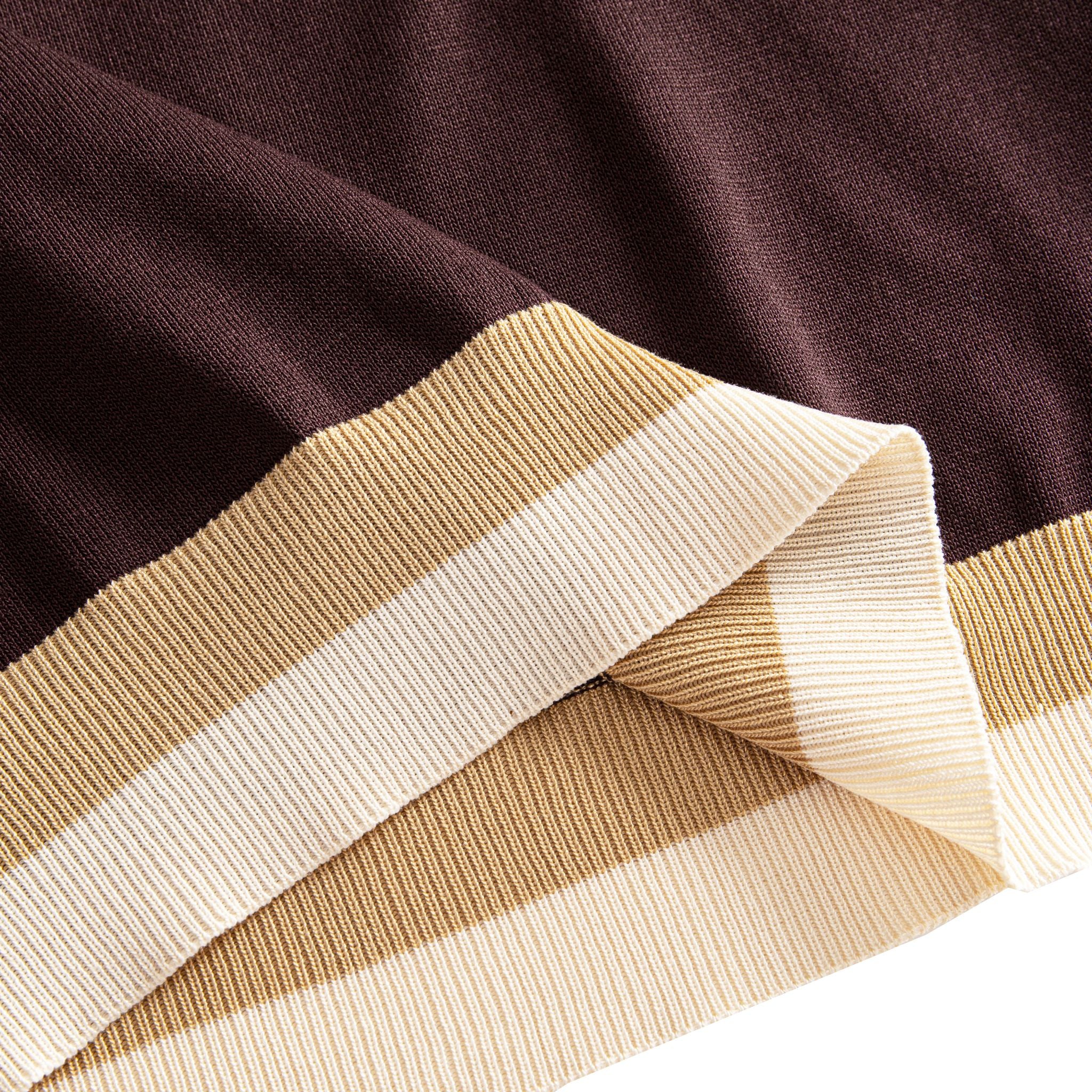 Tri-color blocked ribbed hem close-up, chocolate brown to camel
to off-white, OROMEN color-block knit polo shirt detail