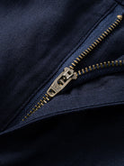 Zipper fly and front button closure detail on OROMEN Navy Linen Trousers